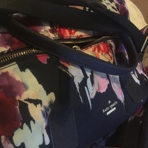 Kate spade pair of luggage.